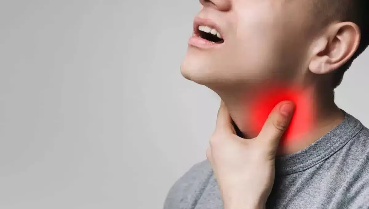 Person touching their throat with red inflammation highlight, showing sore throat or tonsillitis pain